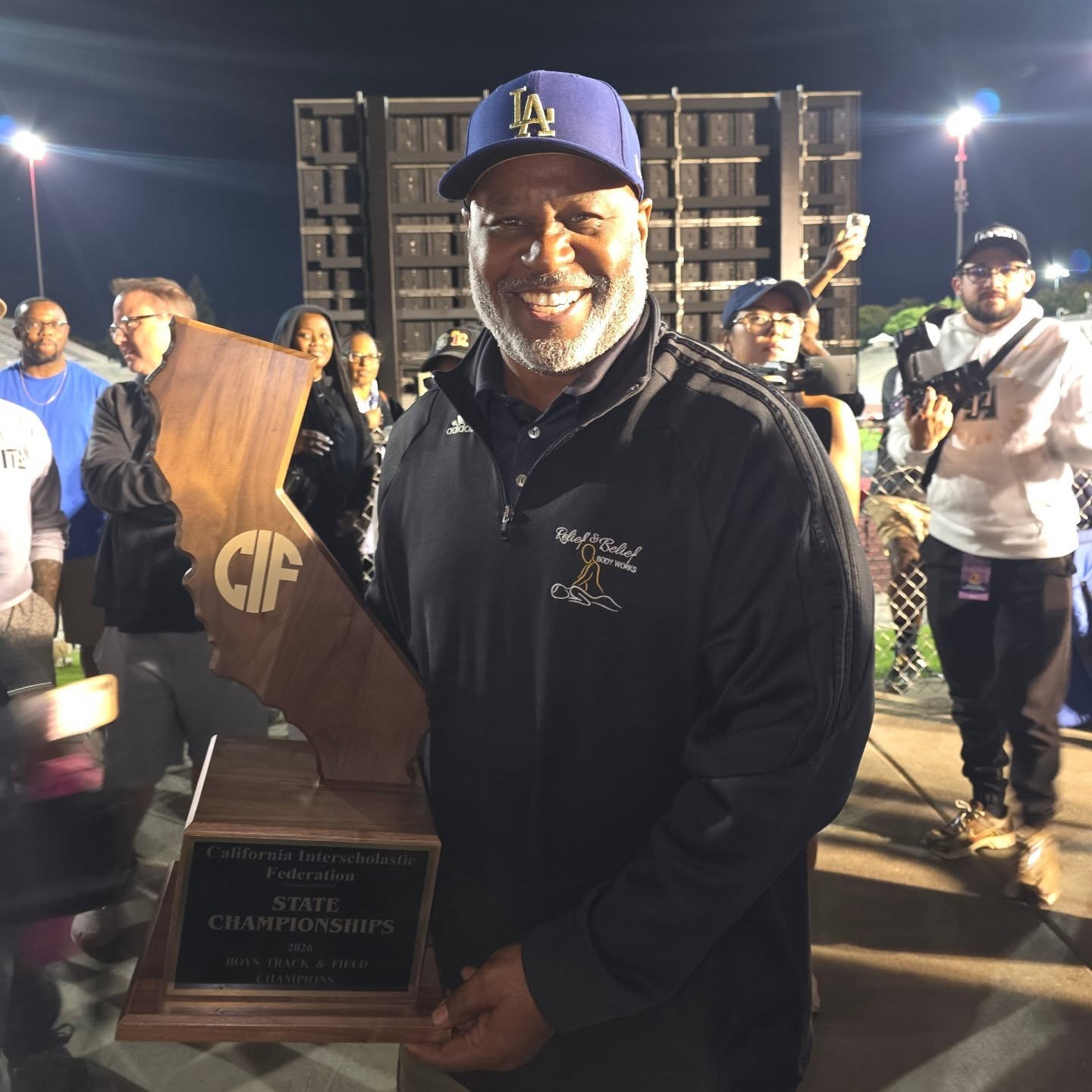Rodney Burnell holding the CIF State Championship trophy
